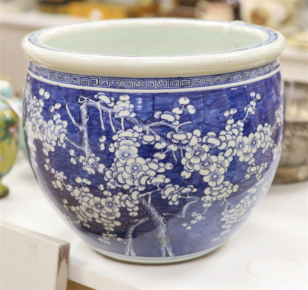 A large Chinese blue and white Prunus jardiniere, late 19th/early 20th century, 31cm high